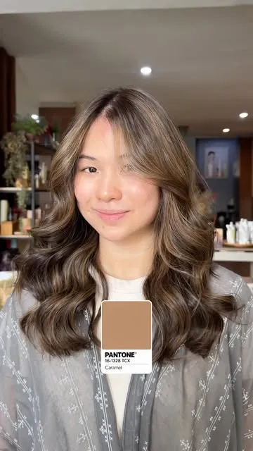 Caramel balayage with soft waves at Alora Pos Pengumben